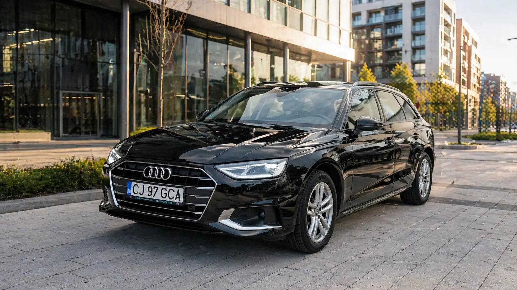 Audi A4 negru pentru inchiriere in Cluj Audi A4 negru disponibil pentru inchiriere in Cluj intr-un cadru urban modern potrivit pentru preluare premium